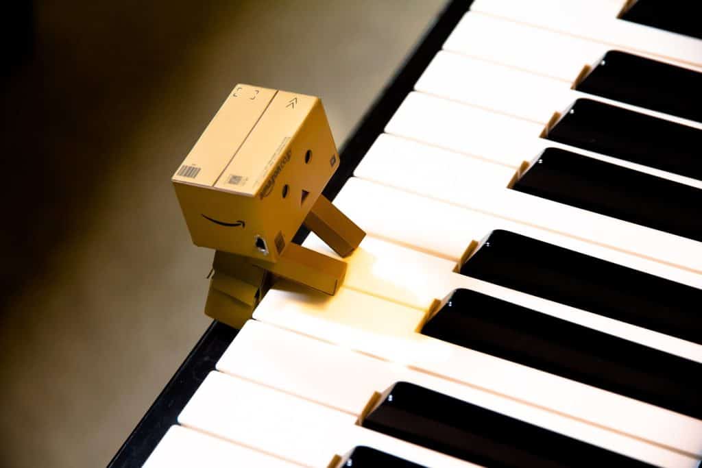 Paper box figure playing piano